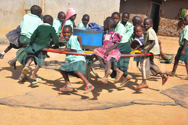 New-Vision-Uganda-Drop-in-the-Bucket pupils of Hope Junior School in Soroti district playing using a wheel pump that is used in the new technology.