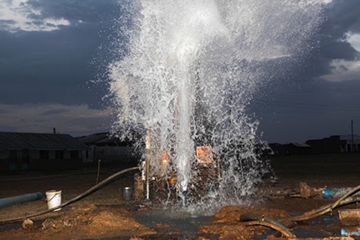 Drop in the Bucket drillers hitting water at a well for the Kyere Township Primary School in Serere, Uganda