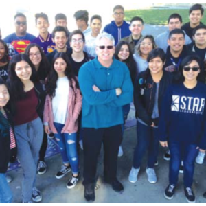 students from Norwalk High with teacher Dean Gray at the schools annual Giving Charity to Charities event. One of the selected charities this year was Los Angeles based water charity Drop in the Bucket.