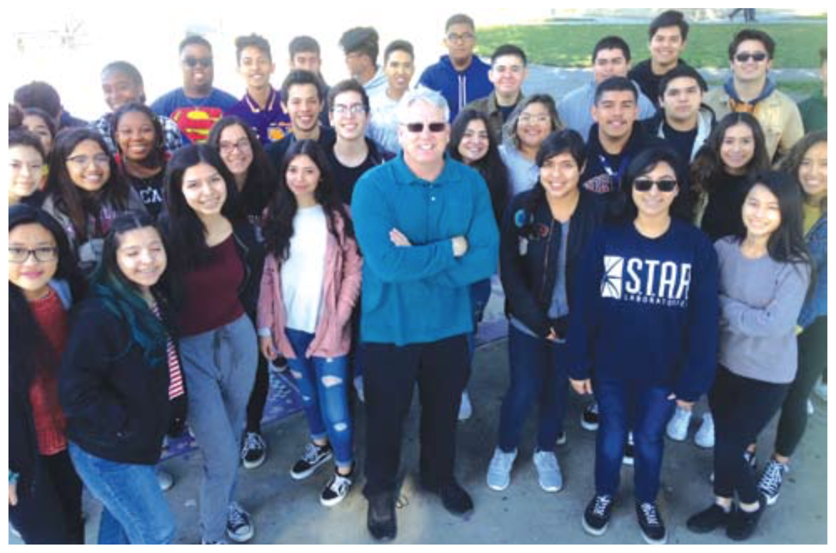 students from Norwalk High with teacher Dean Gray at the schools annual Giving Charity to Charities event. One of the selected charities this year was Los Angeles based water charity Drop in the Bucket.