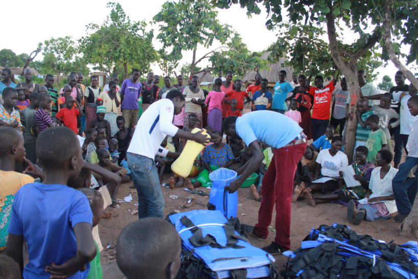 World Refugee Day - Drop in the Bucket field staff distributing Pack H2O water backpacks at the Palabek Refugee Settlement in Uganda.