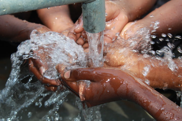 Students getting water at a well in Uganda drilled by Drop in the Bucket in Koboko, Uganda