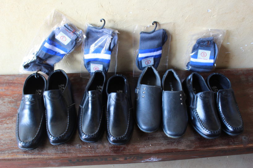 Four pairs of black shoes for students in Uganda from Drop in the Bucket