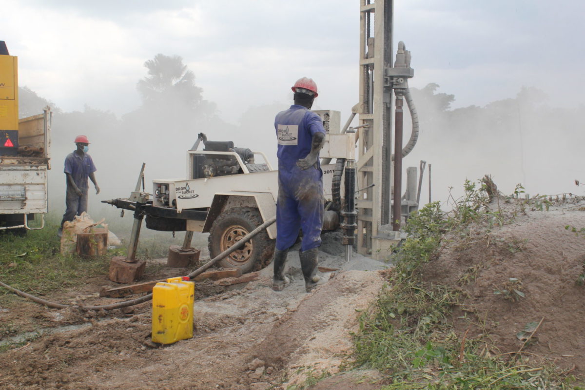 Drop in the Bucket team members drilling a well in northern Uganda