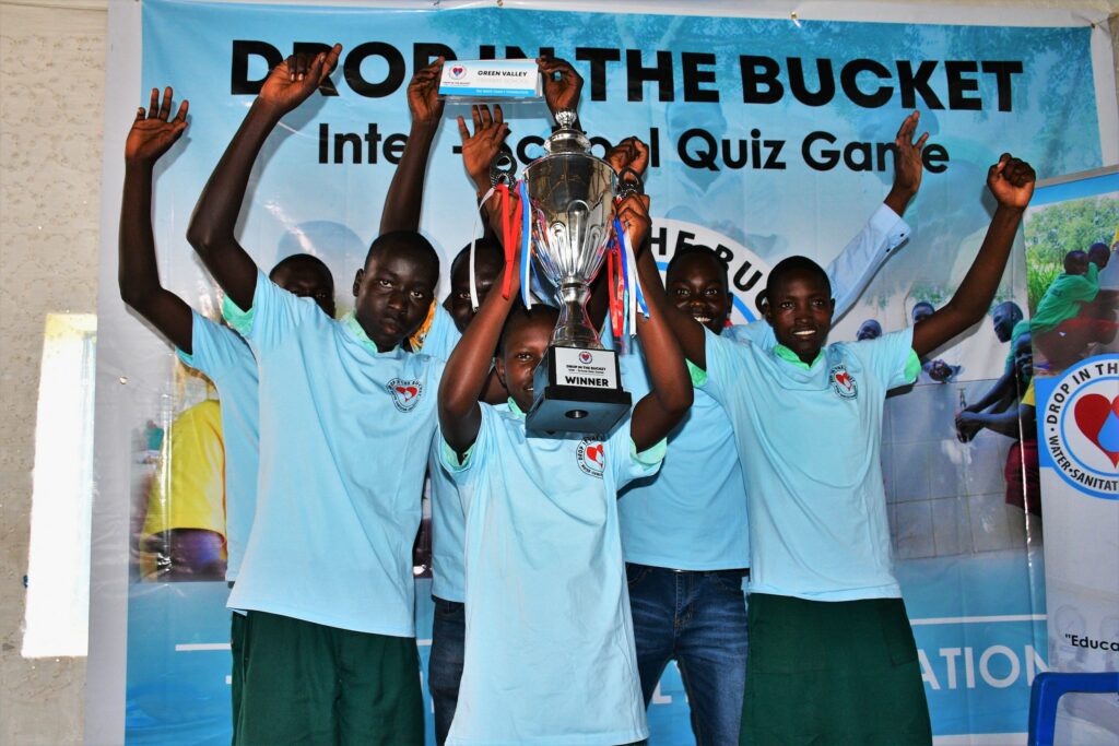 Students celebrate their victory at the first annual Drop in the Bucket inter-school quiz competition in Nimule, South Sudan, 2022.