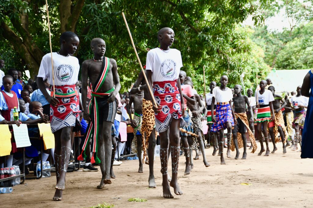 Students performing traditional dances at the International Day of the Girl event in Nimule South Sudan sponsored by Drop in the Bucket