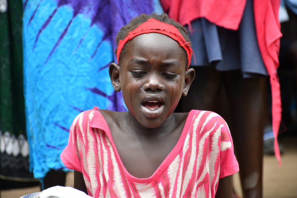 Students performing in a play about hunger at the International Day of the Girl event in Nimule South Sudan sponsored by Drop in the Bucket