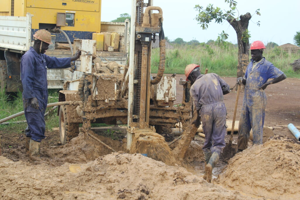 Drop in the Bucket staff drilling a deep well at Ogom Telela Primary School in Pader, Uganda, providing clean water to the community.