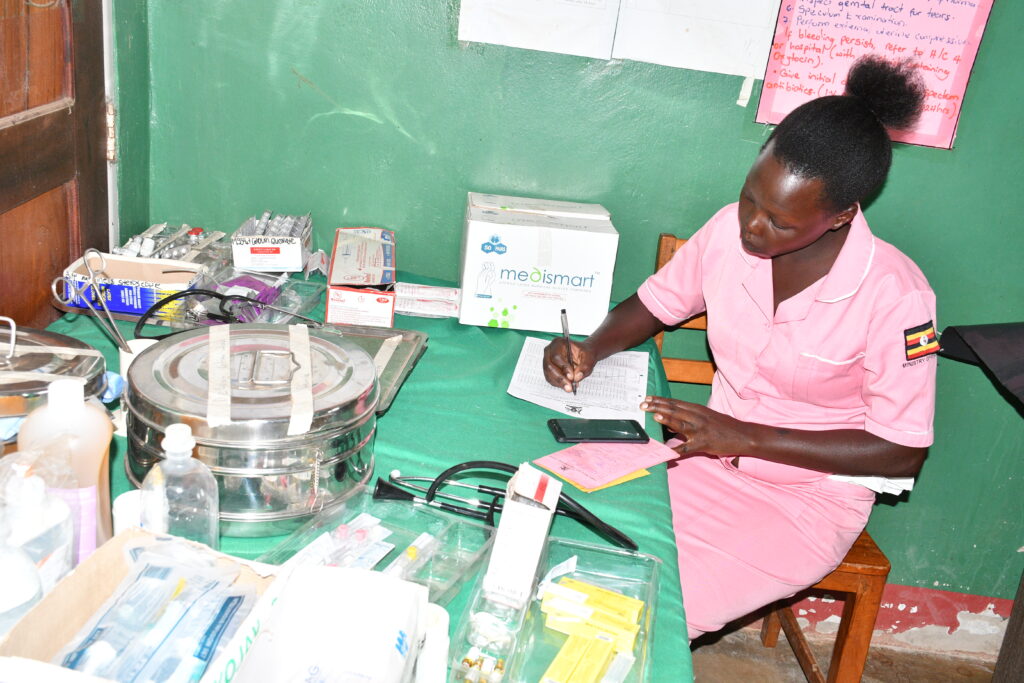 Abodo Tarsis working in the maternity ward of the Alero Health Center III in Nwoya, Uganda.