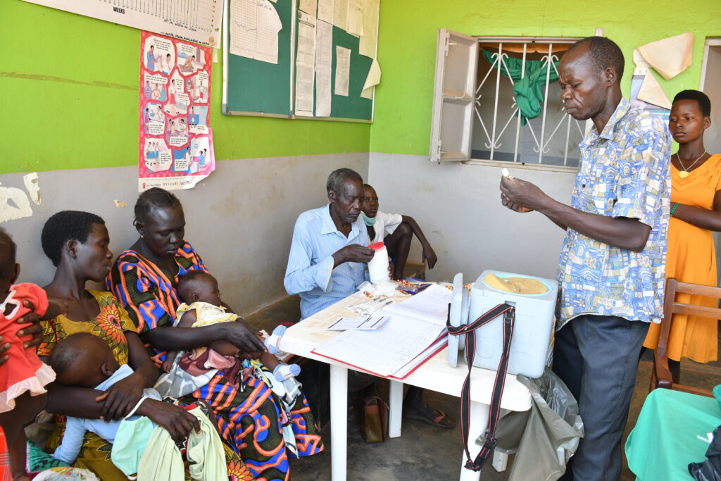 Community members receiving treatment at Alero health center III in Nwoya, Uganda