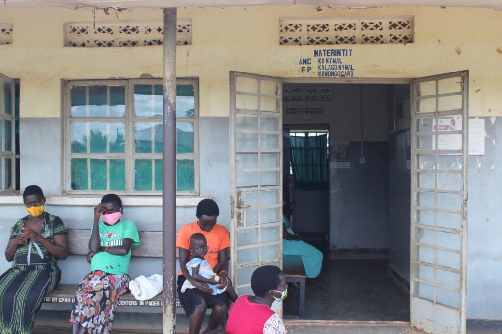 Pregnant women and mothers wait to be treated at the maternity ward of Awere Health Center IV in Pader, Uganda.