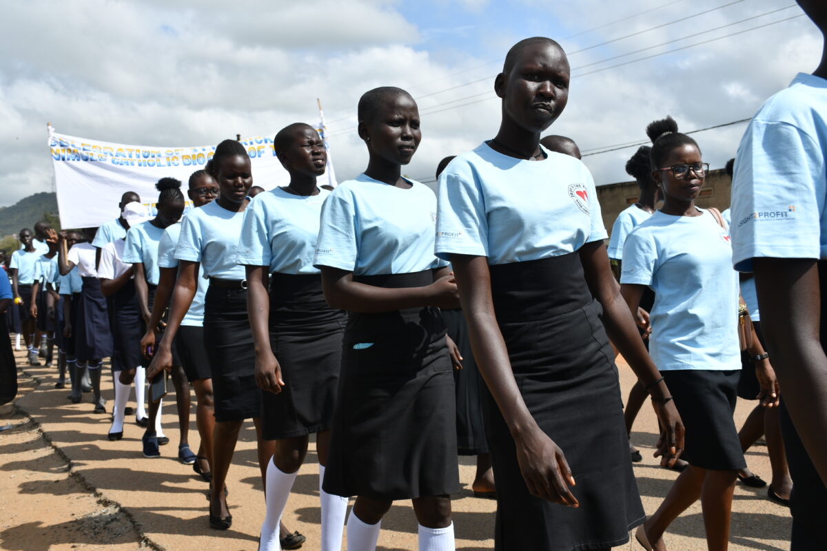 Girls from Drop in the Bucket's education program in South Sudan march in the 2023 International Day of the Girl Child.