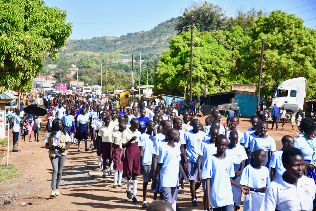 Girls marching for girls rights and gender equality in South Sudan for International Day of the Girl 2024