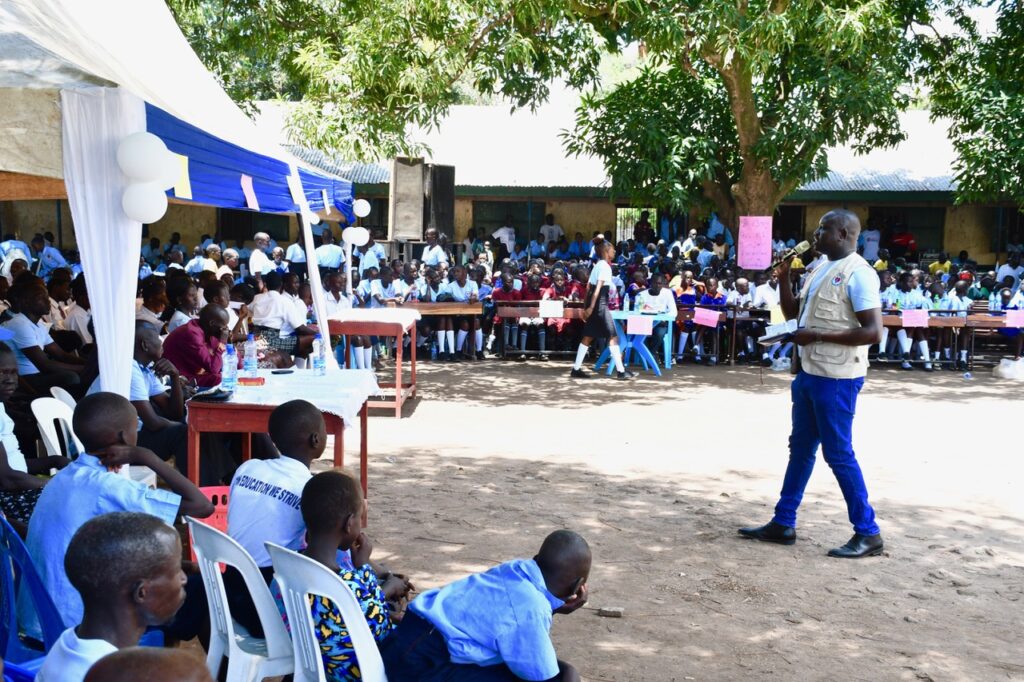 Students listening to speakers in Nimule, South Sudan for International Day of the Girl 2024