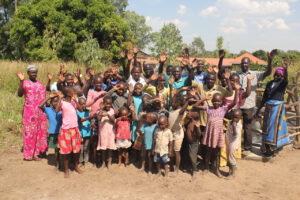 Villagers in Kati Kai A stand by the new water well drilled by Drop in the Bucket