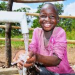 A girl from the Dudtdut village in the Koro sub-county of the Omoro district in Uganda gets clean water from a newly drilled borehole.