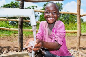 A girl from the Dudtdut village in the Koro sub-county of the Omoro district in Uganda gets clean water from a newly drilled borehole.