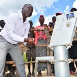 District leader at the commissioning of the new well in Layik A village in Iganga, Uganda
