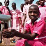 Student from the Kabuli primary school in Iganga Uganda getting clean water from the newly drilled borehole
