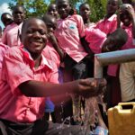 Student from the Kabuli primary school in Iganga Uganda getting clean water from the newly drilled borehole