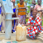 A local woman gets clean water from the newly drilled borehole in Latengelere village in Nwoya, Uganda