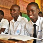 Students from the Gulu Central Secondary School study at their desks.