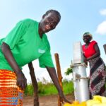Community members from Tukupe community in Amuru, Uganda using the new well drilled by Drop in the Bucket