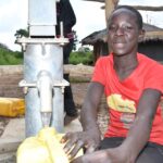 Children from duddut village in Omoro, Uganda gets clean water from the new well drilled by Drop in the Bucket