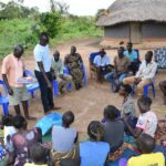 Meeting of the VLSA group formed around the well at Dutdut village in Omoro, Uganda