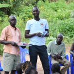 Meeting of the VLSA group formed around the well at Dutdut village in Omoro, Uganda
