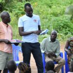 Meeting of the VLSA group formed around the well at Dutdut village in Omoro, Uganda