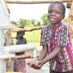 Getting clean water from the new water well in Baribari  in Amuru, Uganda