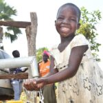 Getting clean water from the new water well in Baribari  in Amuru, Uganda