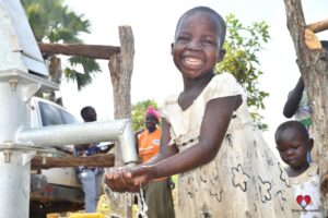 Getting clean water from the new water well in Baribari in Amuru, Uganda
