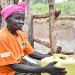 Getting clean water from the new water well in Baribari  in Amuru, Uganda