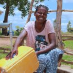 Getting clean water from the new water well in Opok village in Nwoya, Uganda