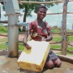 Getting clean water from the new water well in Opok village in Nwoya, Uganda