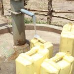 Clean water flows from the new water well in Opok village in Nwoya, Uganda