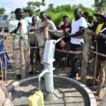 Getting clean water from the new water well in Opok village in Nwoya, Uganda