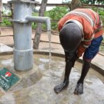 Getting clean water from the borehole in Awer in Amuru, Uganda