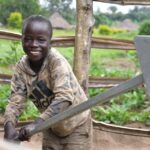 Getting clean water from the new water well in Awer in Amuru, Uganda