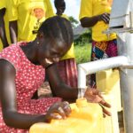 Getting clean water from the borehole in Ogony village, Bargede Layibi Gulu, Uganda