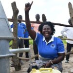 Community members from Lakwatomer-Korga-community, getting clean water from the borehole in Koro, Omoro, Uganda