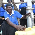 Community members from Lakwatomer-Korga-community, getting clean water from the borehole in Koro, Omoro, Uganda