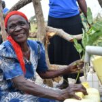 Community members from Lakwatomer-Korga-community, getting clean water from the borehole in Koro, Omoro, Uganda