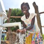 A child from Lakwatomer-Korga-community, getting clean water from the borehole in Koro, Omoro, Uganda