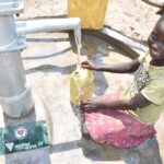 A child from Lakwatomer-Korga-community, getting clean water from the borehole in Koro, Omoro, Uganda