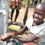 Getting clean water from the borehole in Panycwala village, Laroo-Pece-Gulu, Uganda