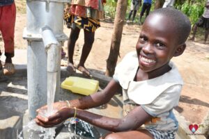 Getting clean water from the borehole in Panycwala village, Laroo-Pece-Gulu, Uganda