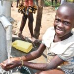Getting clean water from the borehole in Panycwala village, Laroo-Pece-Gulu, Uganda